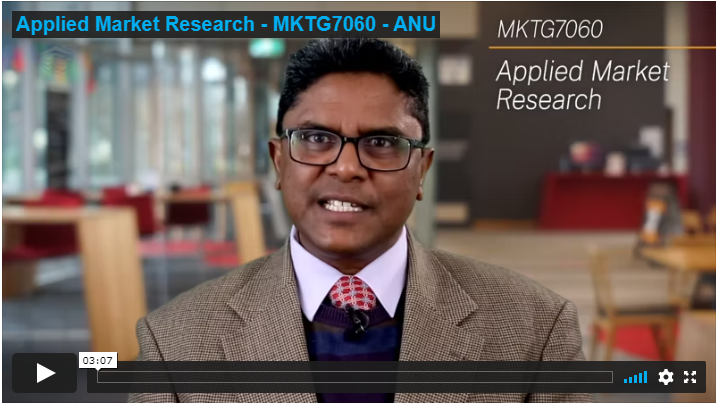 screenshot of an embedded video with professor for Applied Market Research course